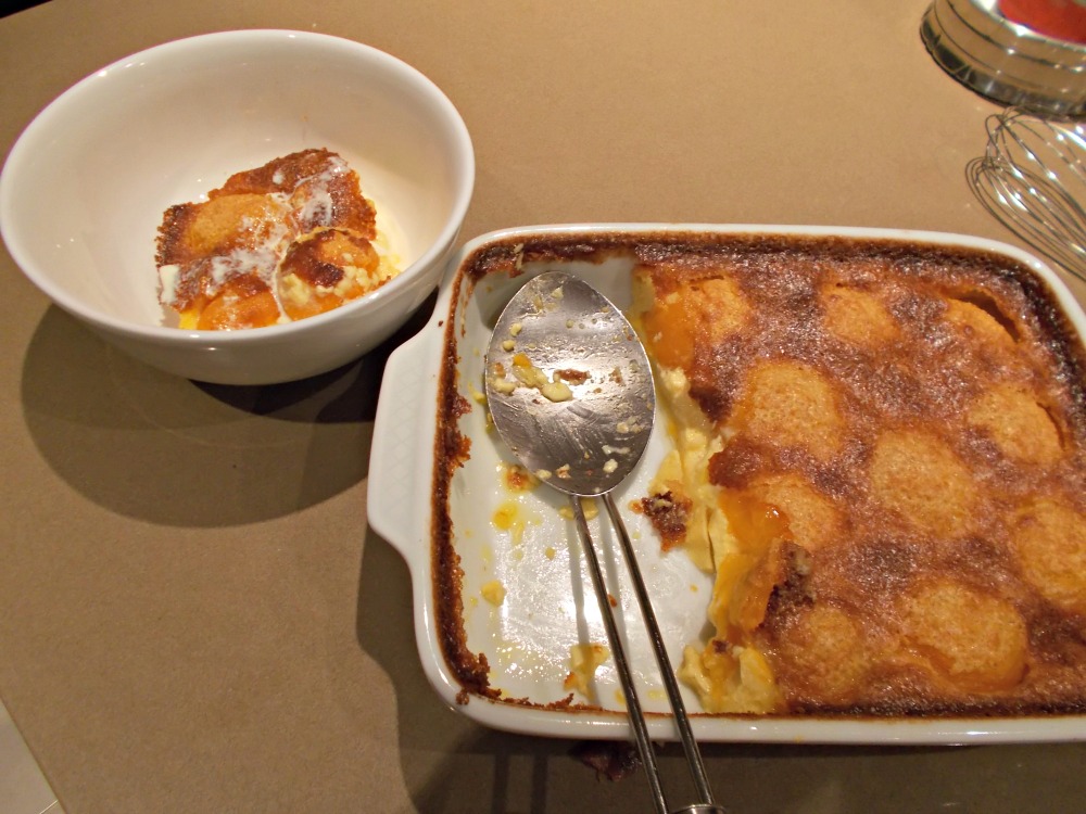 The baked apricot clafoutis served with a drizzle of cream.