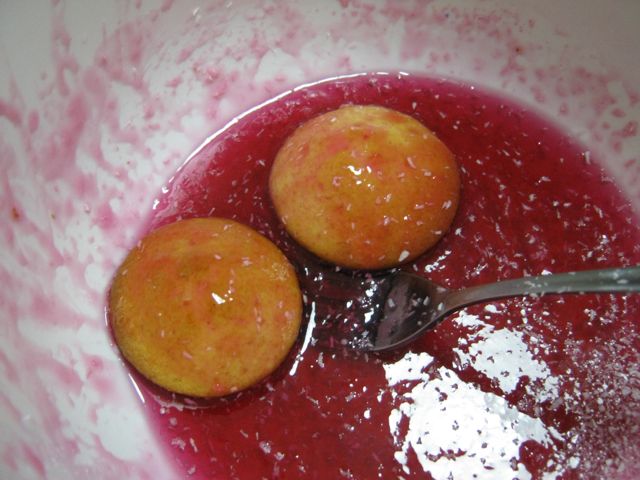 Jelly cakes being coated in jelly