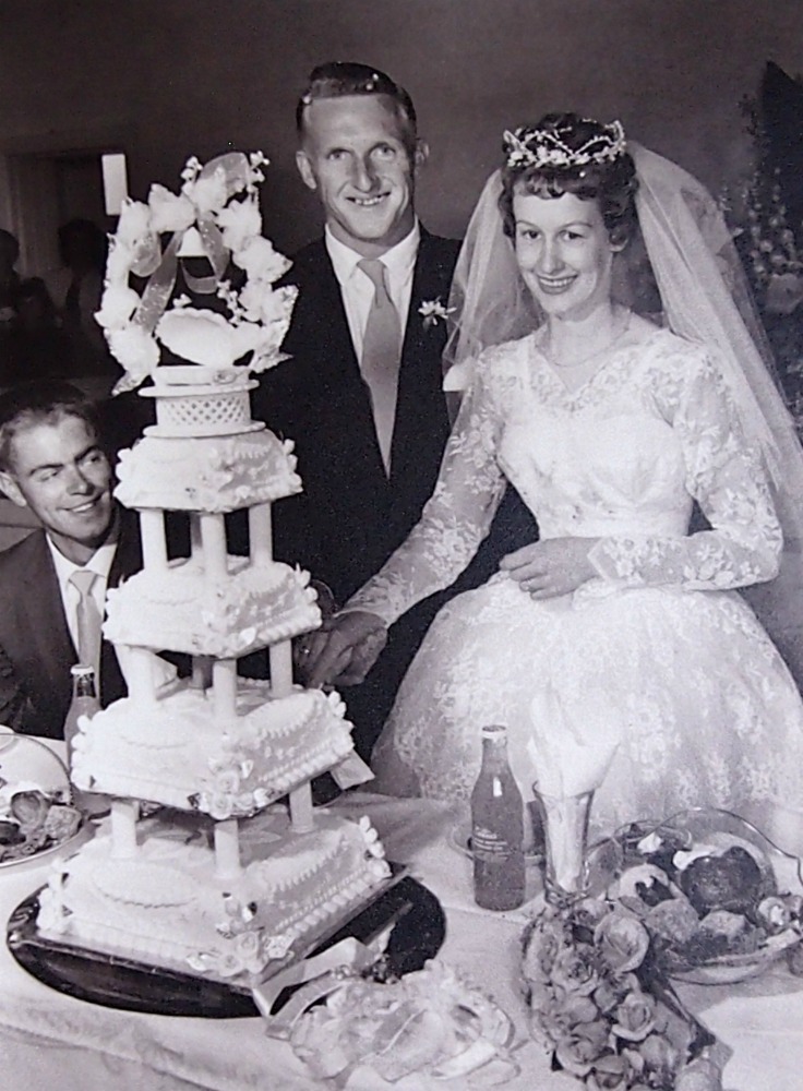 Cutting the wedding cake.